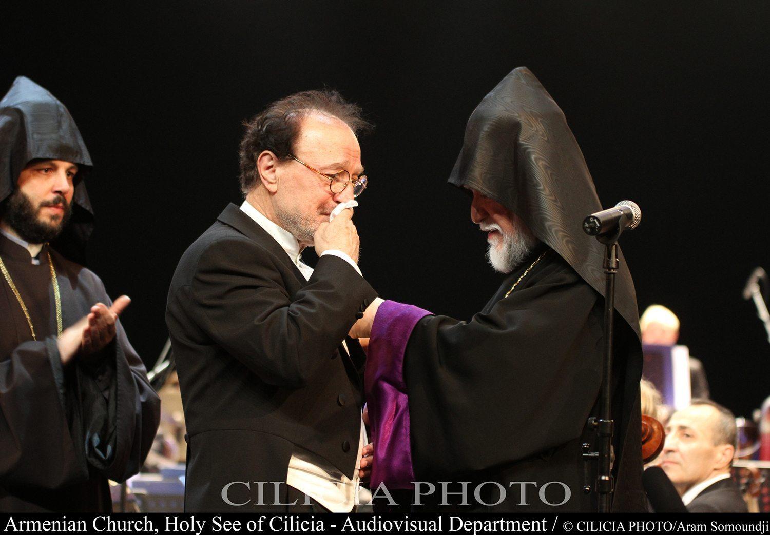 His Holiness Aram I decorates Vartan Melkonian, an orphan of Birds’ Nest and a conductor of the Royal Philharmonic Orchestra based in London
